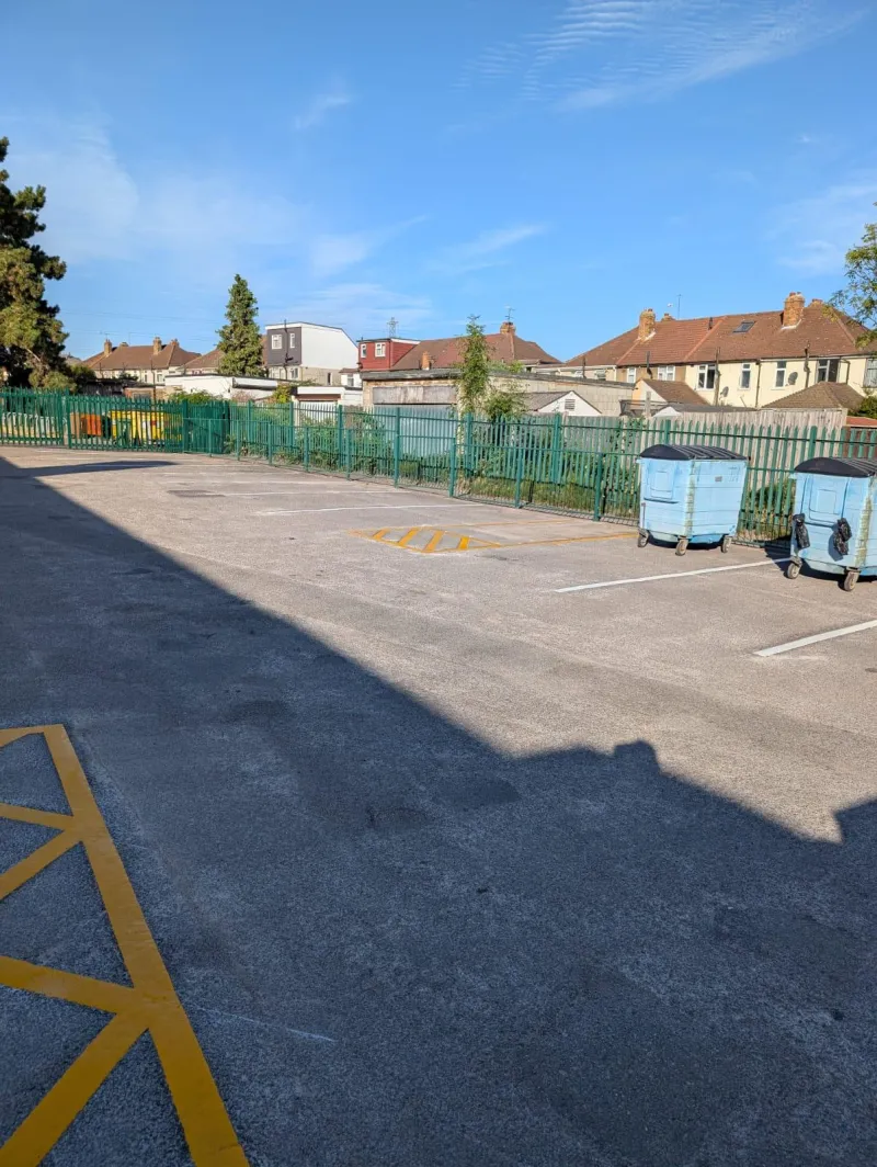 Freshly resurfaced car park with new white parking bay lines