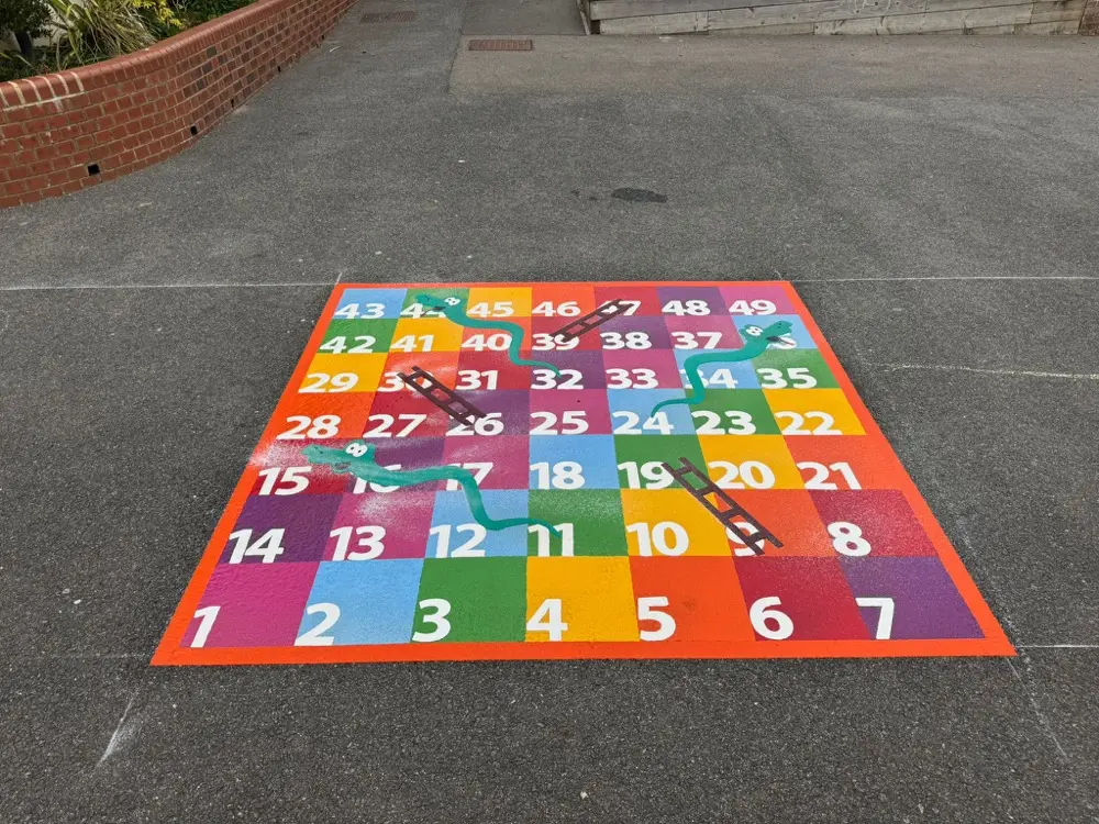 1 to 49 Snakes and Ladders thermoplastic playground marking at a UK school