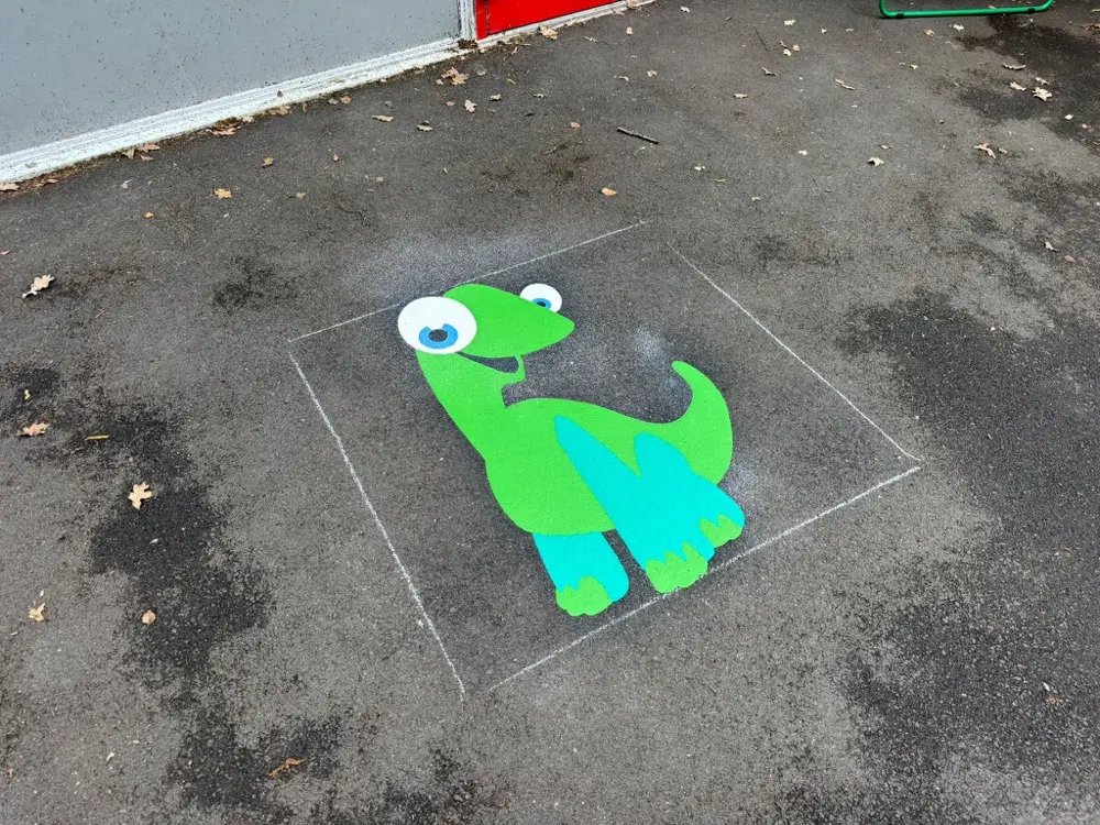 Dinosaur thermoplastic playground marking at a UK school