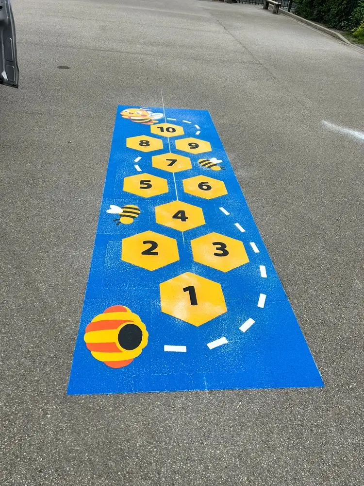Bee Hopscotch thermoplastic playground marking at a UK school