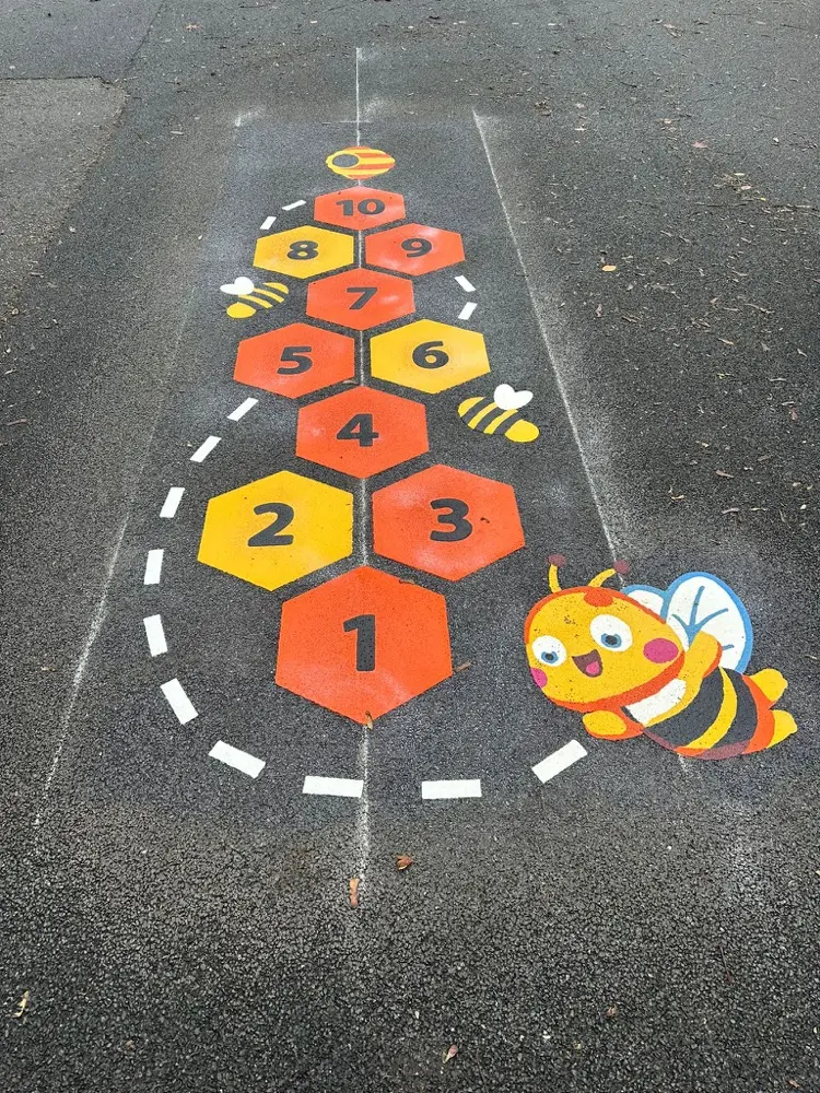 Bee Hopscotch thermoplastic playground marking at a UK school