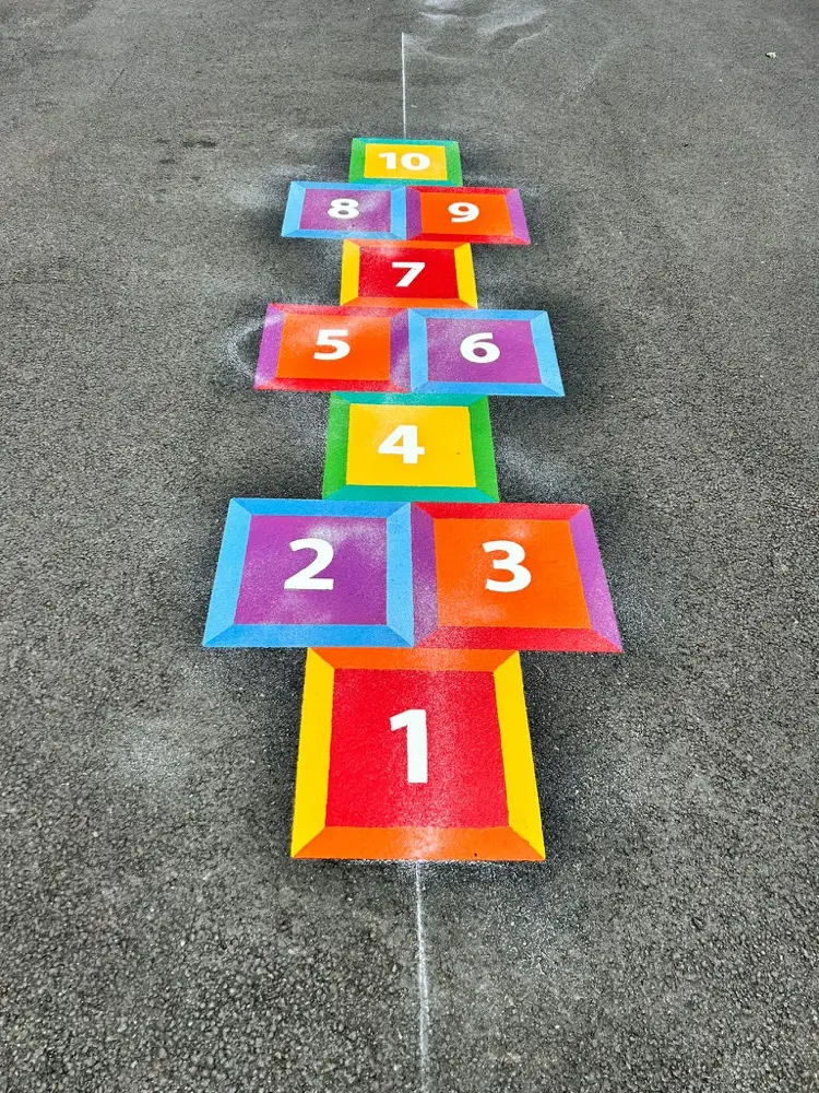 Hopscotch thermoplastic playground marking at a UK school