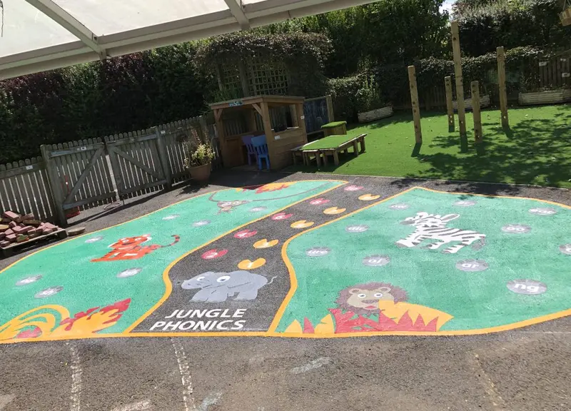 Colourful themed thermoplastic markings on a primary school playground