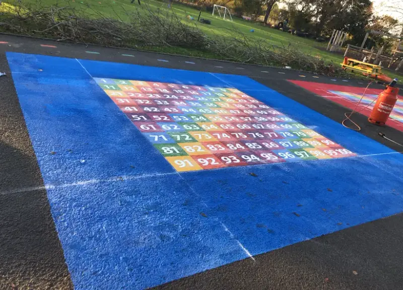 Colourful thermoplastic playground markings installed by Uniplay