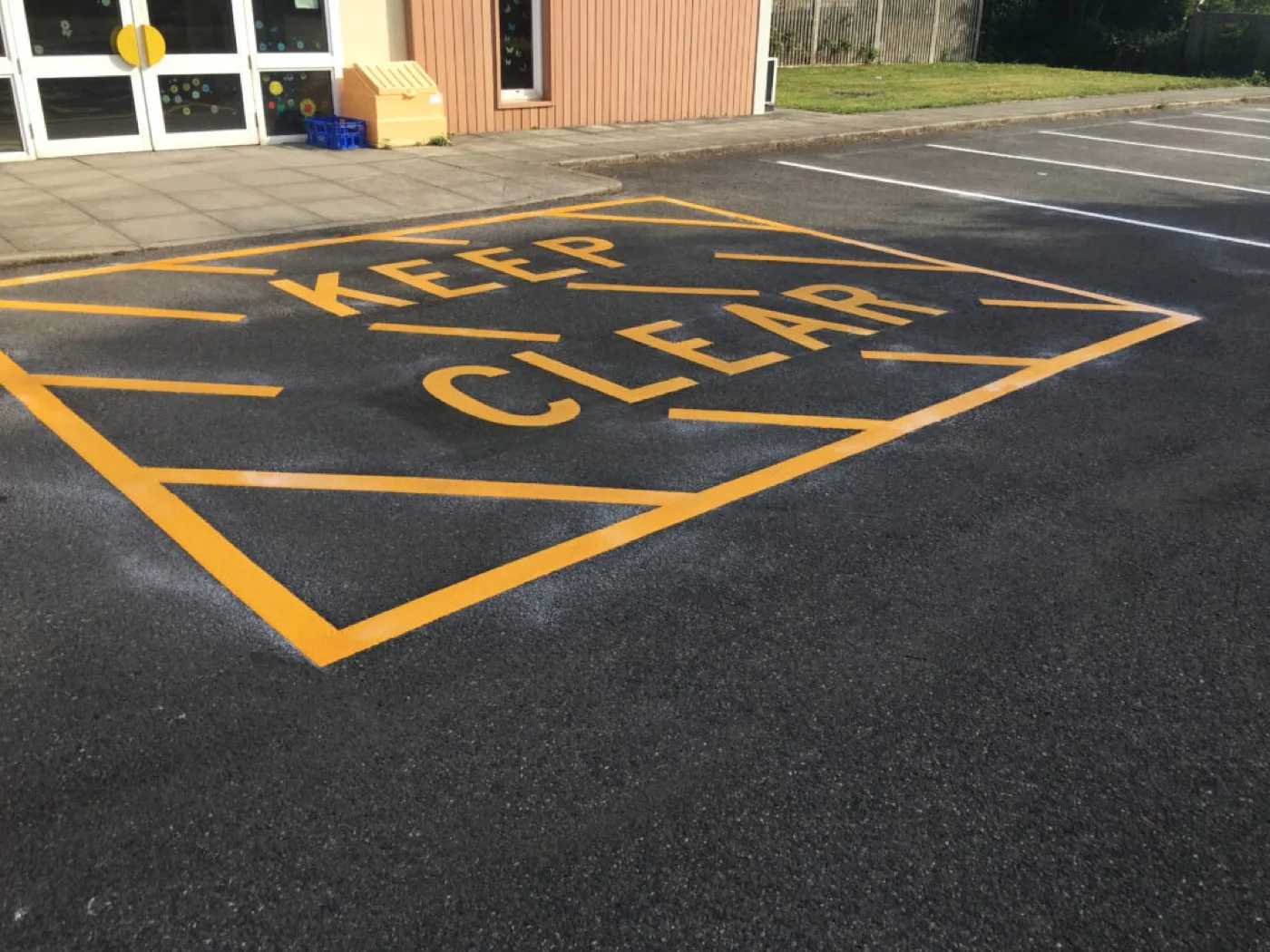 Car park line markings and directional arrows in thermoplastic