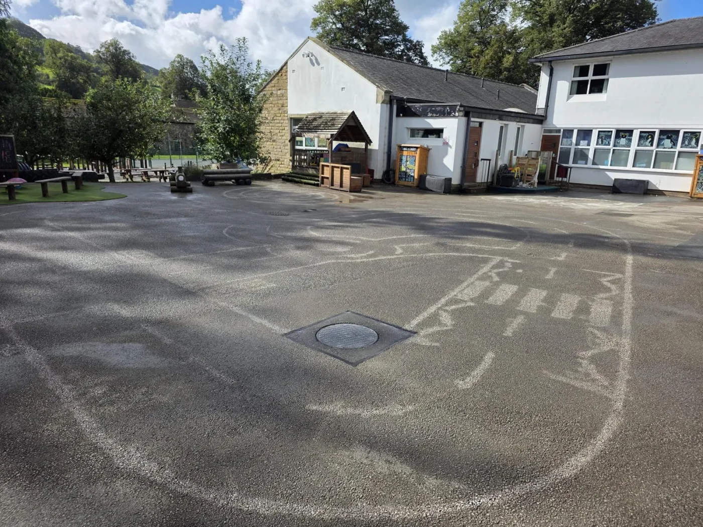 A school playground surface cleared after thermoplastic marking removal