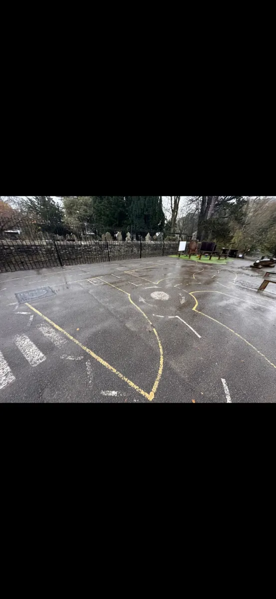 A Uniplay operative removing markings from a surface with specialist water blasting equipment