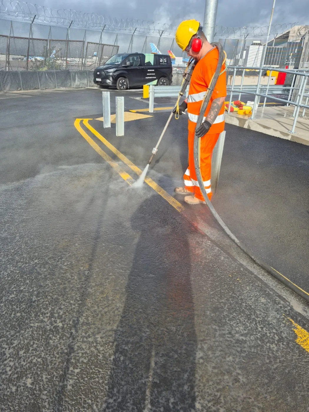 Uniplay UHP jetting rig removing worn playground markings