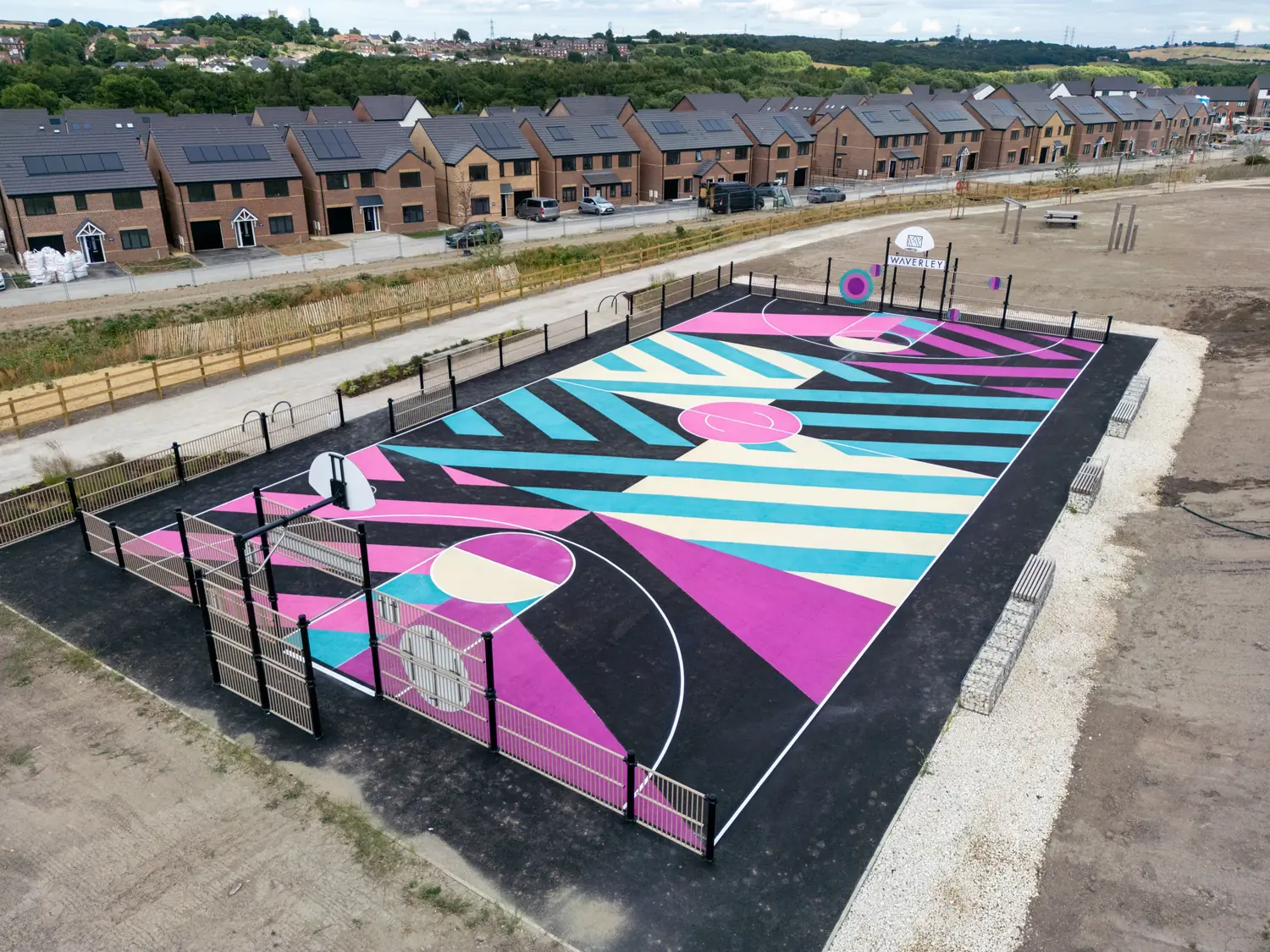 Aerial view of a vibrant Uniplay school playground with bold, colourful thermoplastic markings